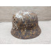 Battle damaged winter camo relic Helmet M35 